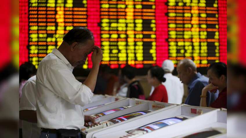 Sliding yuan hits world stock markets, stokes trade war fears