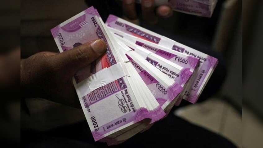 Rupee touches record low of 69.50 against dollar; Sensex, Nifty also down