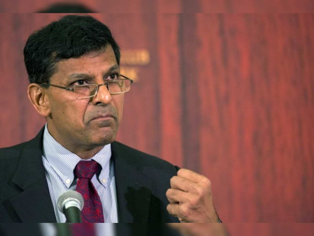 Raghuram Rajan says rupee needs modest weakening after