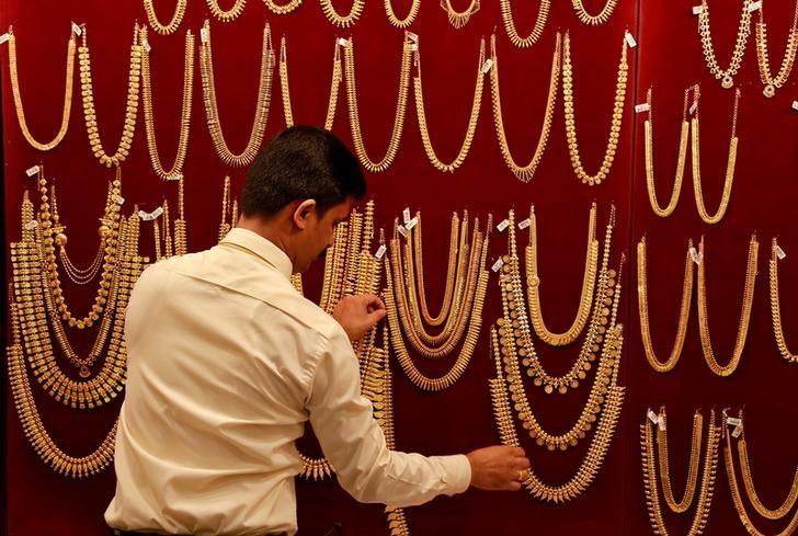 Gold remains higher on global cues, festive demand