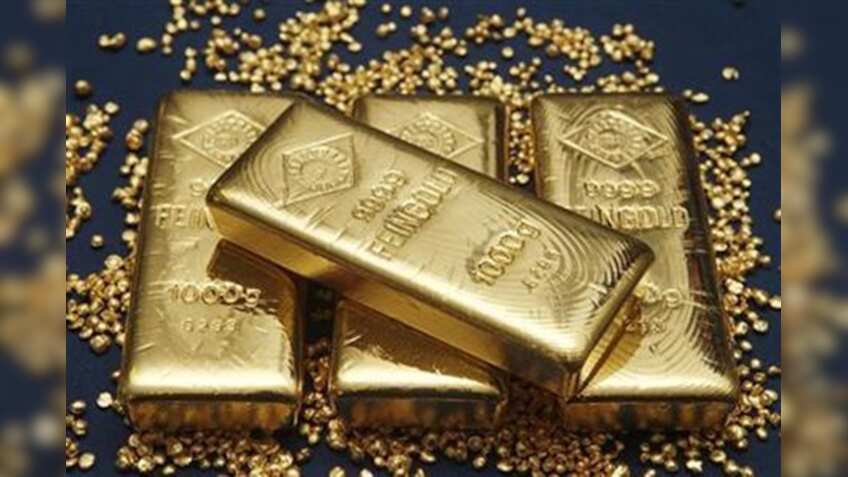 Gold falls Rs 450 on weak global cues, tepid demand