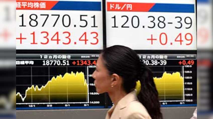 Asian stocks trade tepid on global economic slowdown worries, rise in dollar index