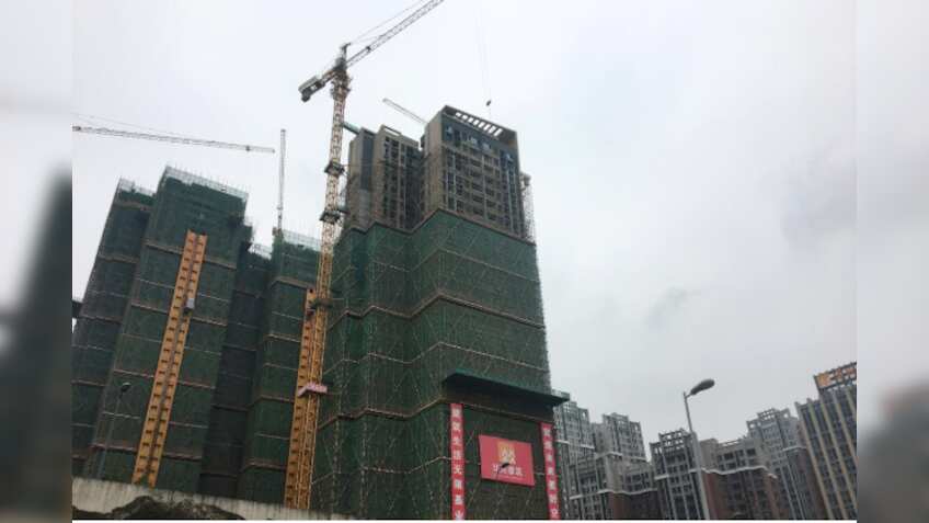 China's March property investment grows most in eight months on looser policy