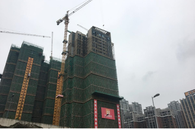 China's March property investment grows most in eight months on looser policy