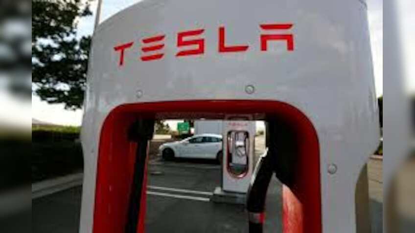 Tesla posts massive $702 million loss last quarter