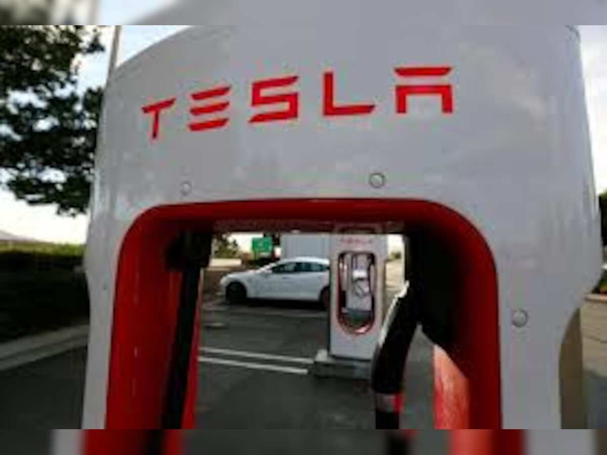 Tesla posts massive $702 million loss last quarter