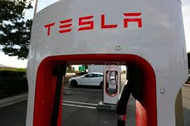Tesla posts massive $702 million loss last quarter