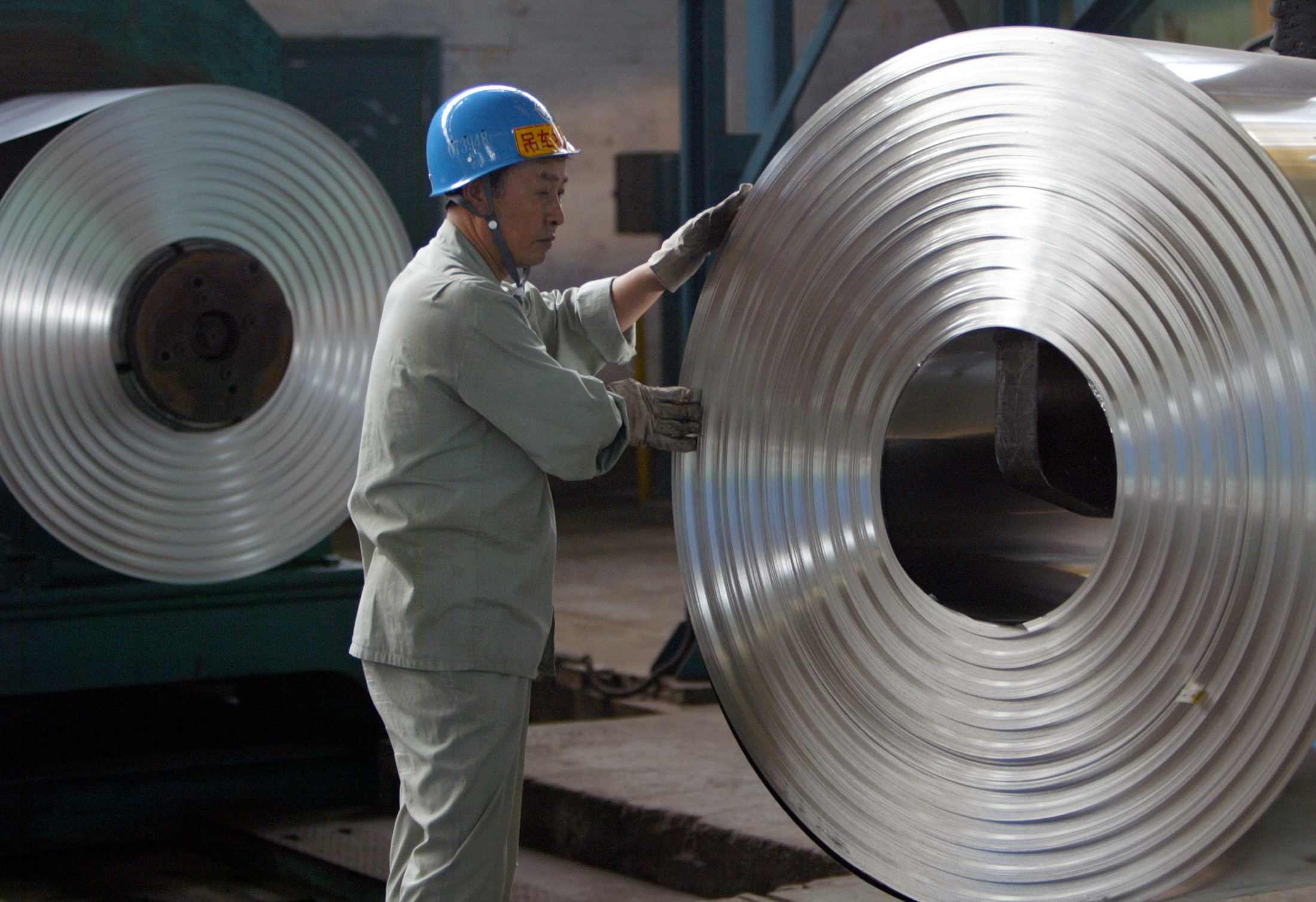 China April industrial output cools, retail sales growth falls to 16-yr low as trade risks rise