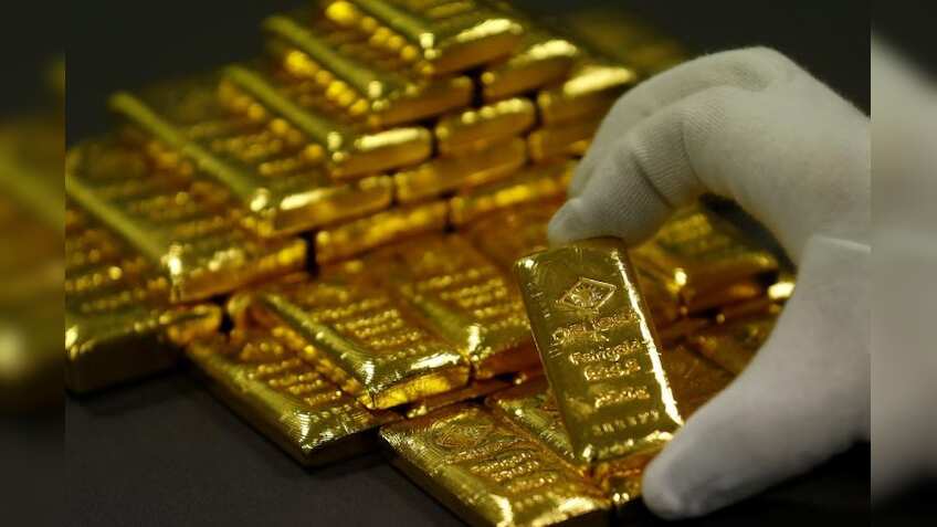 Gold prices ease as dollar bounces back from multi-week lows