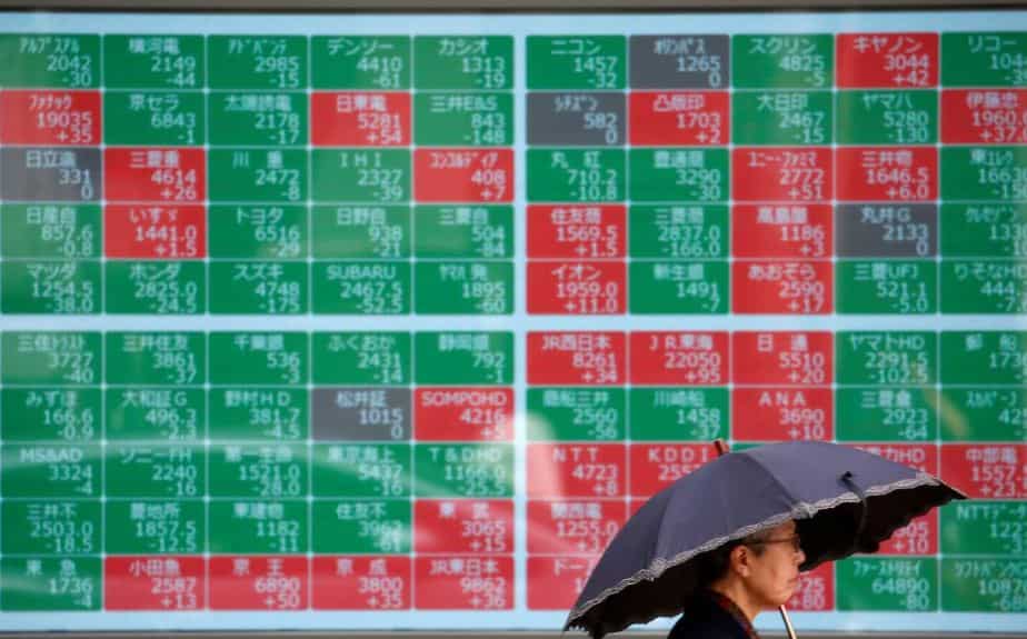 Asian shares hit 14-week highs on trade deal hopes