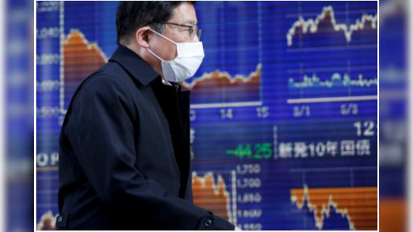 Asian shares grind lower amid vaccine doubts, economic concern