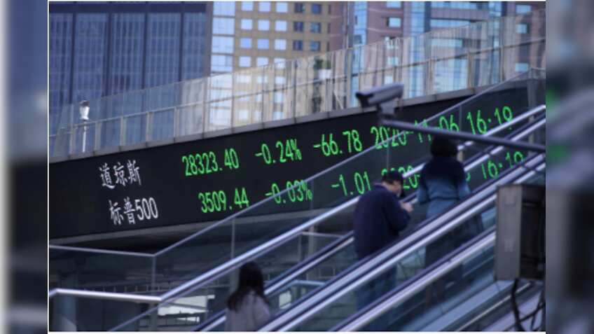 Asian shares edge lower but stimulus, vaccine hopes provide support