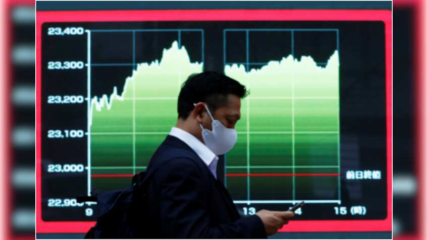 Asian shares mixed, U.S. dollar near 2-1/2 year lows