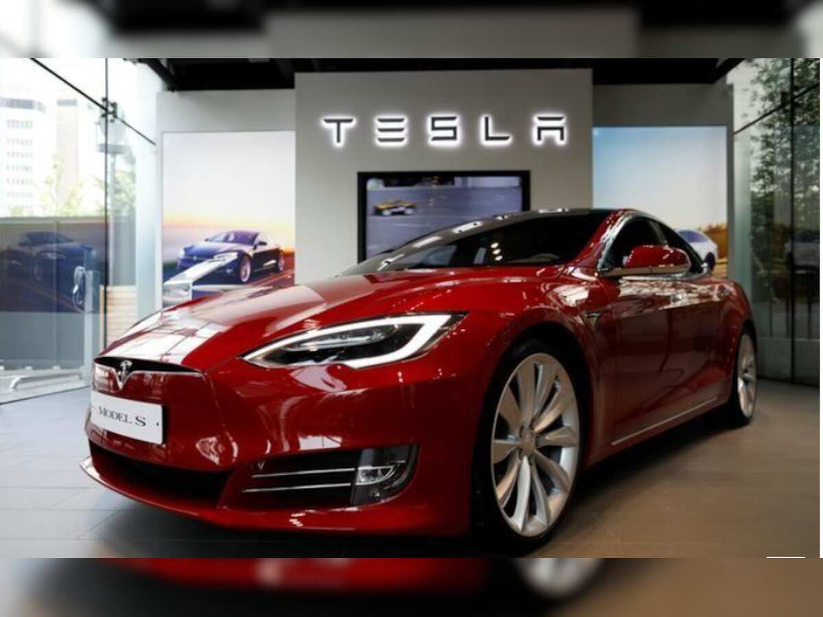Tesla shares jump to record high ahead of
