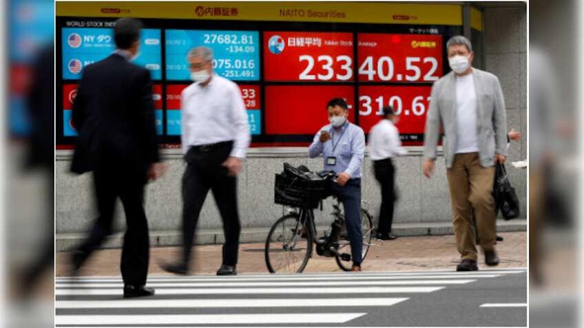 Global shares edge up on news Trump signs aid bill
