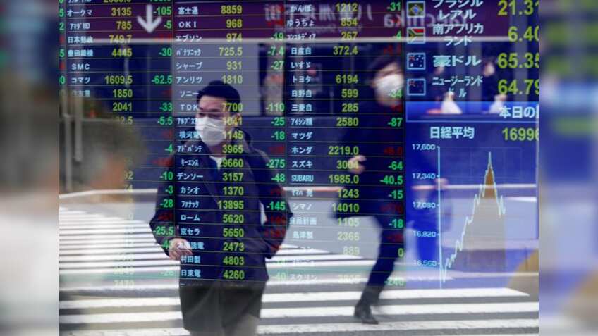 Asian markets fight for footing as investors fret over Evergrande crisis