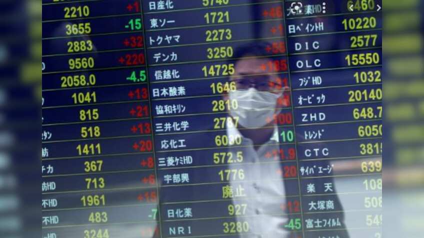 Asian shares decline, as US treasury yields hold firm after US inflation data