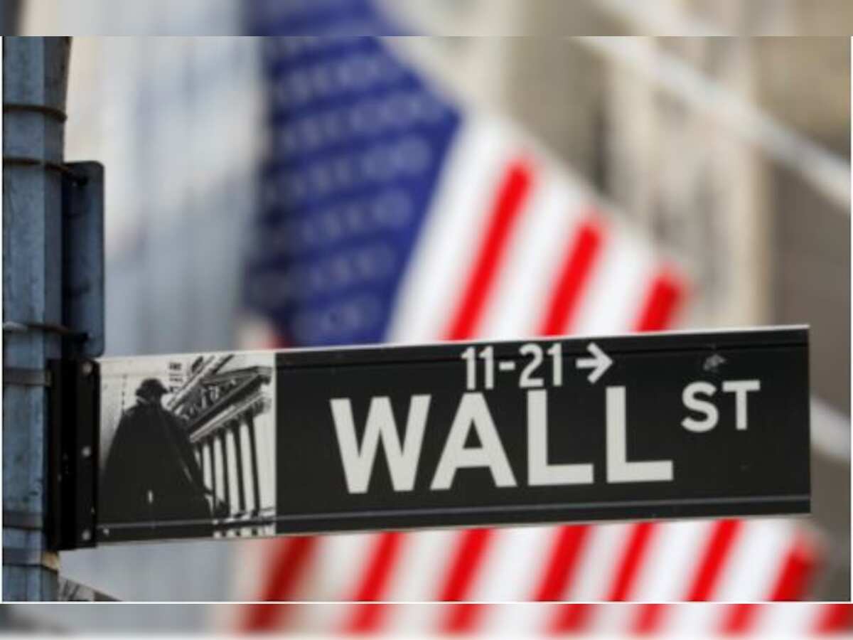 Wall Streets ends down, oil gains as Powell