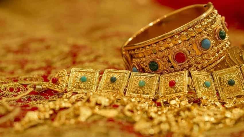 Gold marginally higher by Rs 21;  silver gains Rs 37