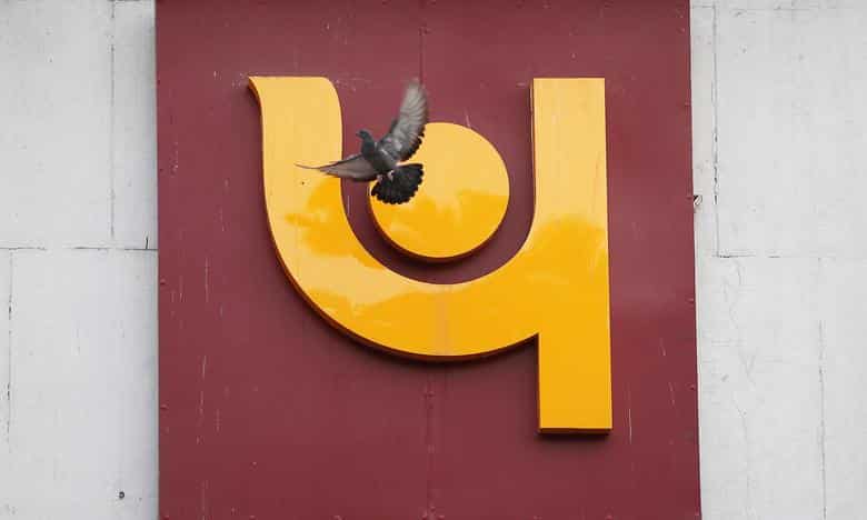 Smartphone with website of Indian company Punjab National Bank (PNB) on  screen in front of business logo. Focus on top-left of phone display Stock  Photo - Alamy