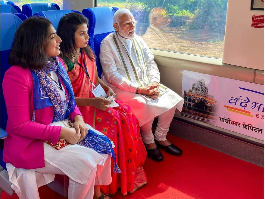 PM interacts with railway officials aboard the Vande Bharat Express. 