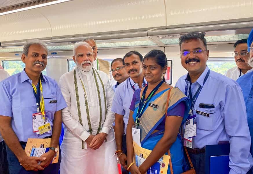 Prime Minister Modi with railway officials aboard the Vande Bharat Express from Gandhinagar to Ahmedabad.