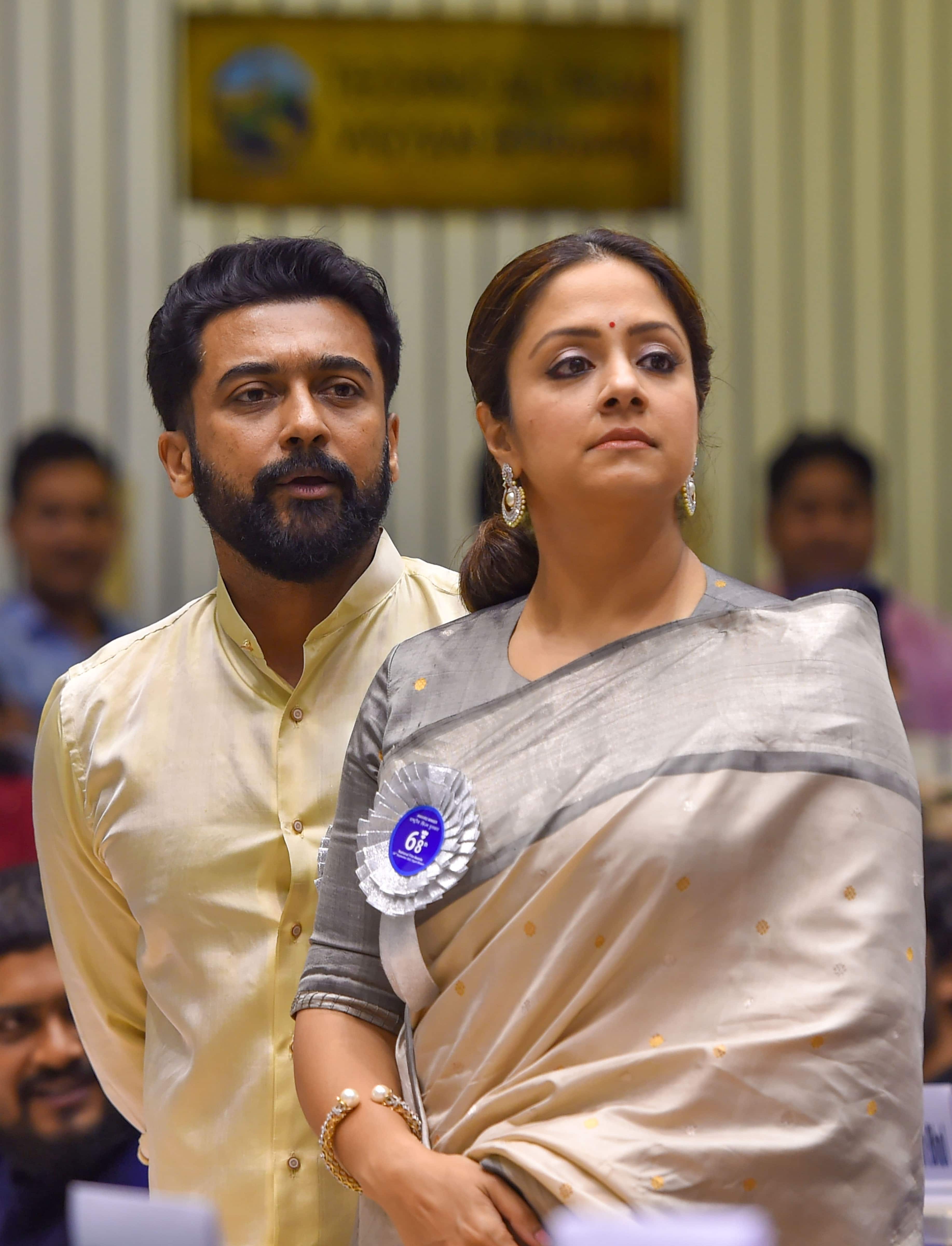 Tamil actor Suriya with actor-wife Jyothika during the 68th National Film Awards presentation ceremony (PTI Photo)