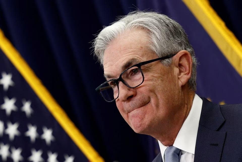 Fed holds benchmark US interest rate, sees two