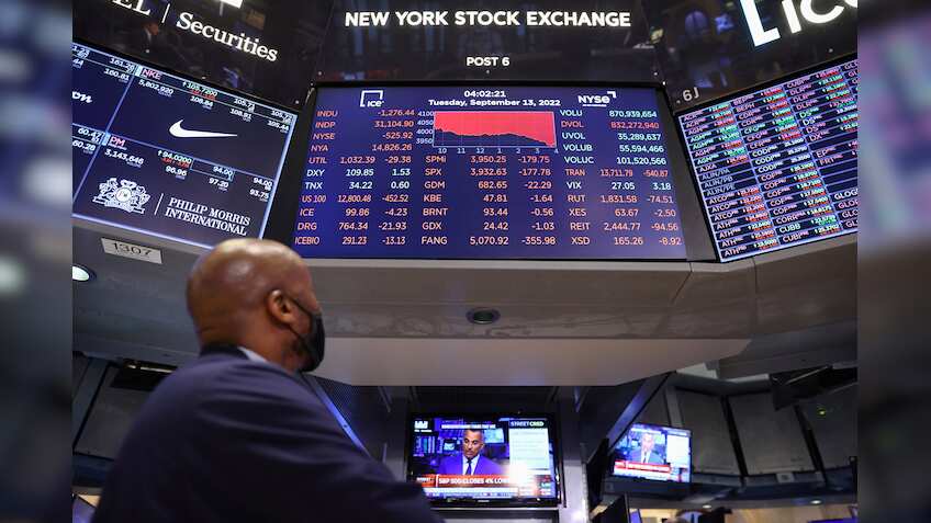 US stocks end mixed after Federal Reserve signals more rate hikes to come