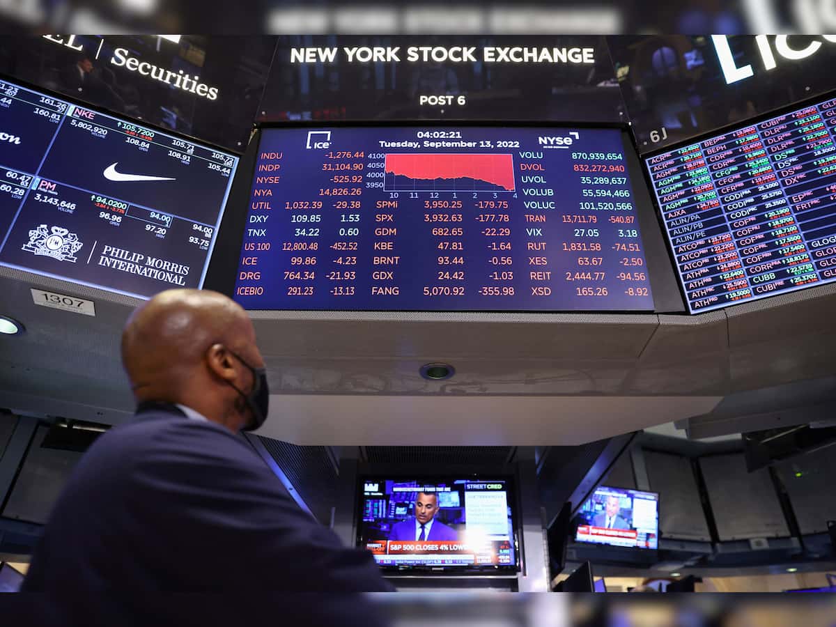 US stocks end mixed after Federal Reserve signals more rate hikes to come