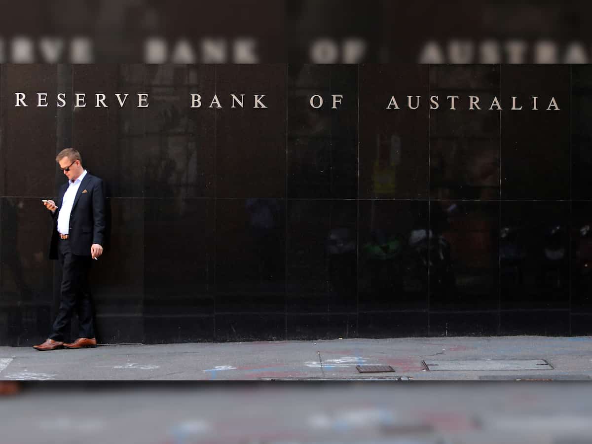 Australian central bank leaves its benchmark cash rate at 4.1% but warns there may be further hikes 