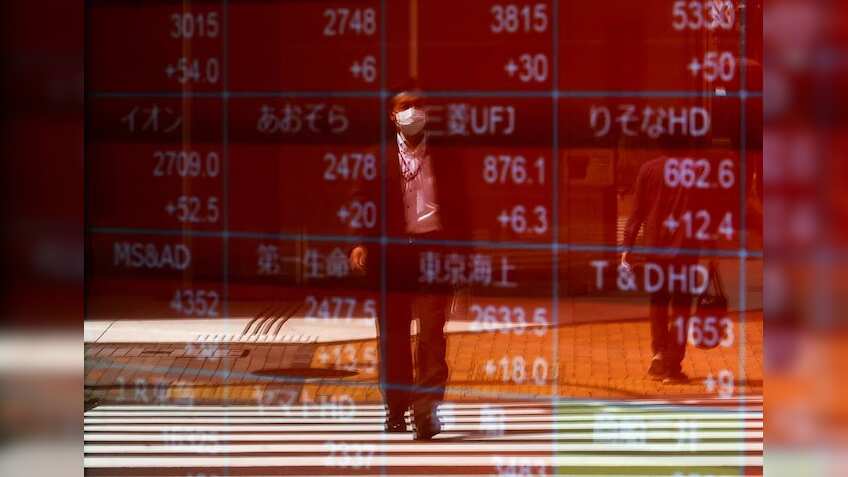Asia stocks gain; US futures slip after Netflix, Tesla earnings