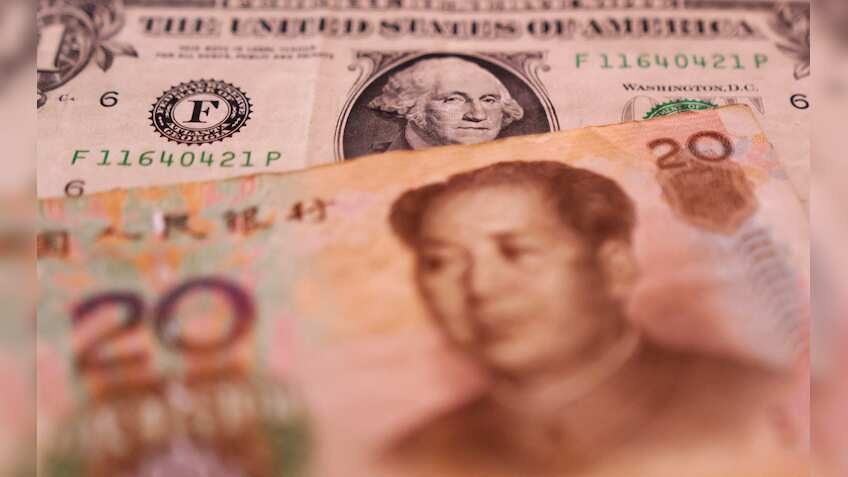 China asks some banks to reduce or delay dollar buying, sources say 