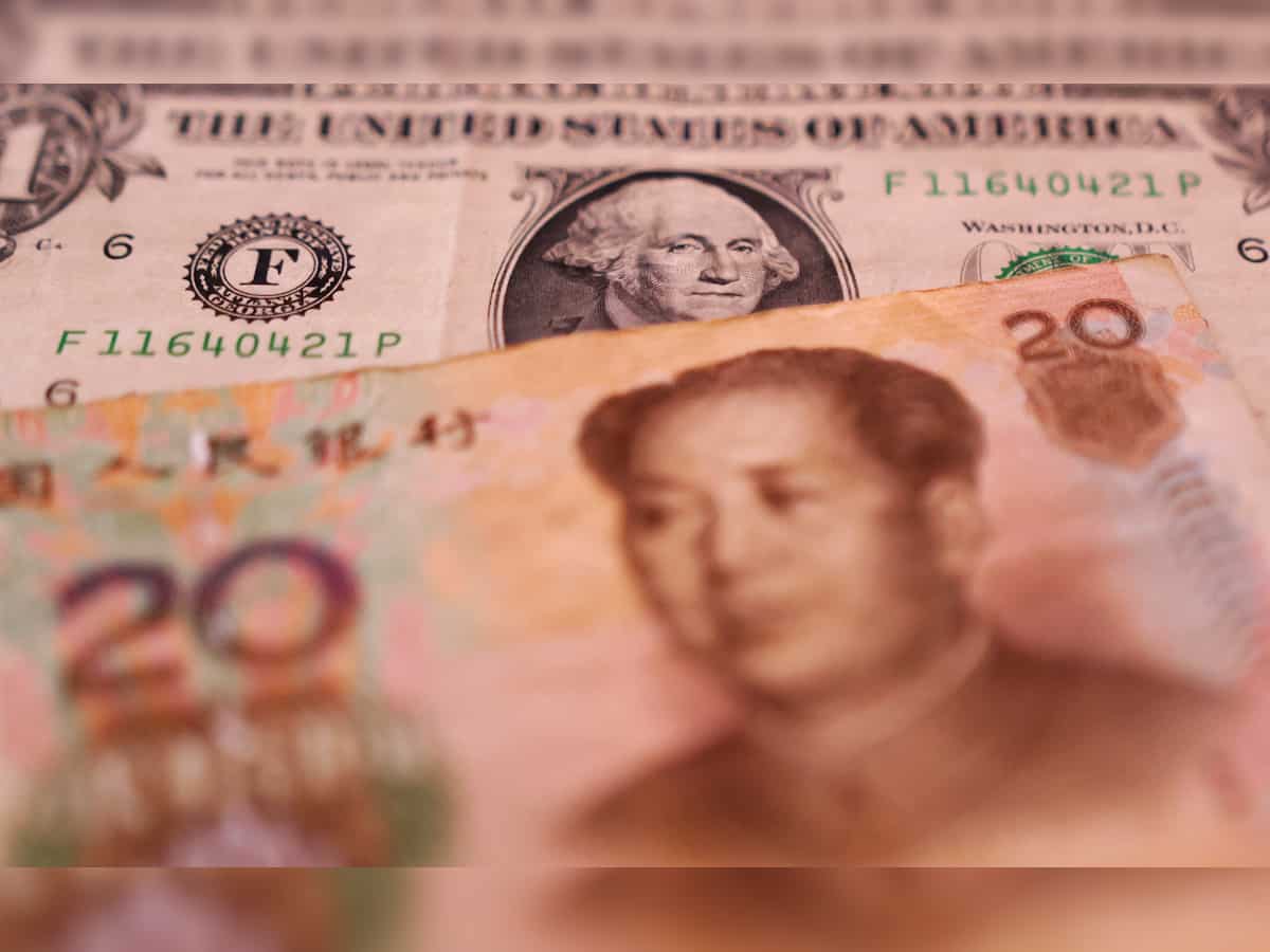 China asks some banks to reduce or delay dollar buying, sources say 
