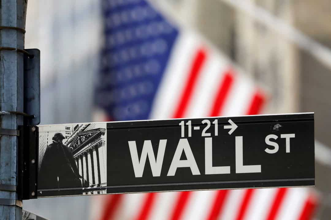 Wall Street closes lower after Fed holds rates steady warns of