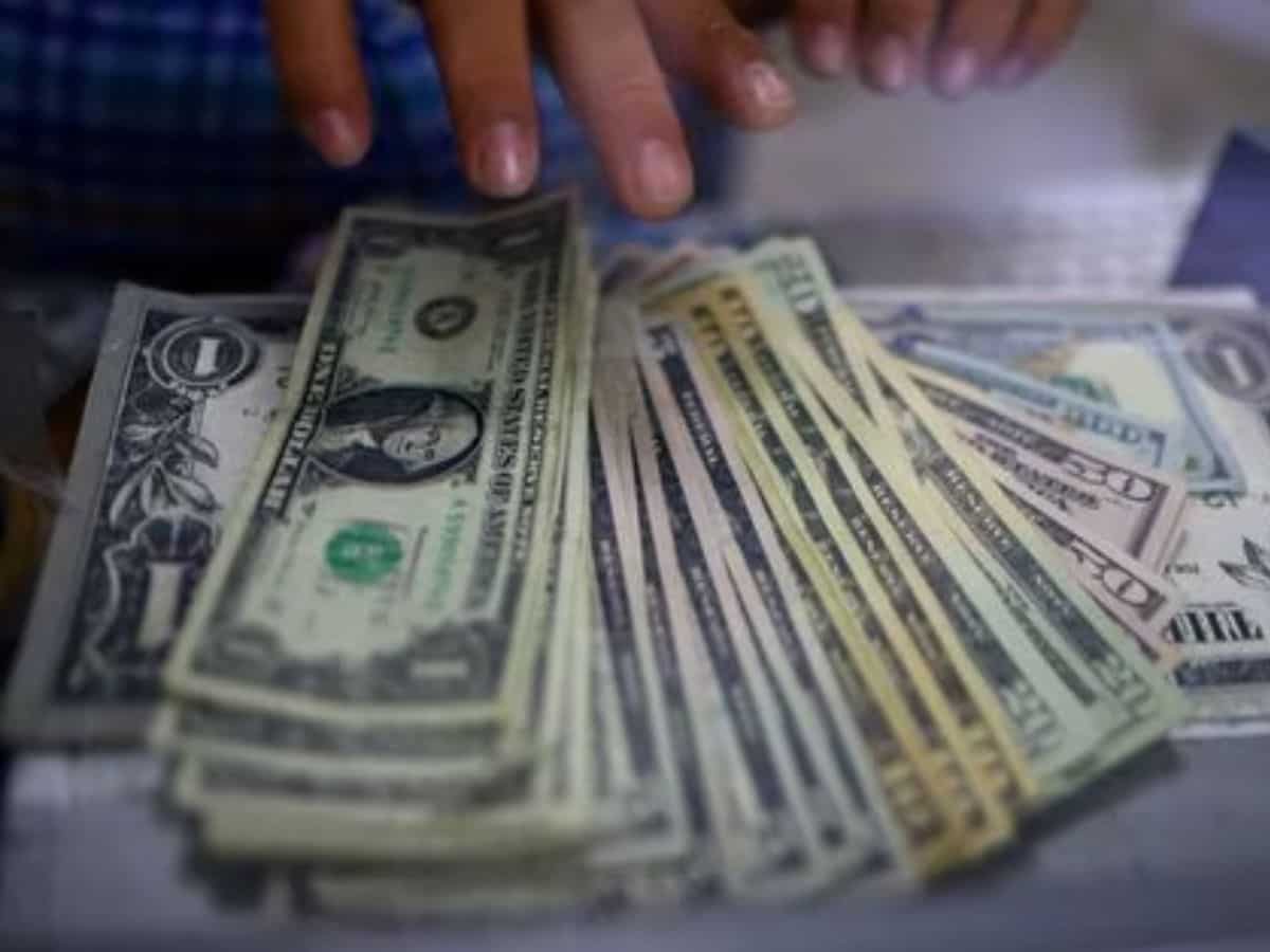 Dollar holds on to gains after firm US inflation; focus turns to China data