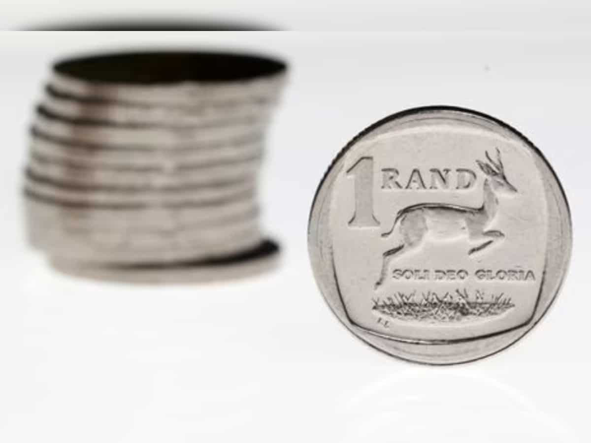 South African rand slightly stronger against muted dollar