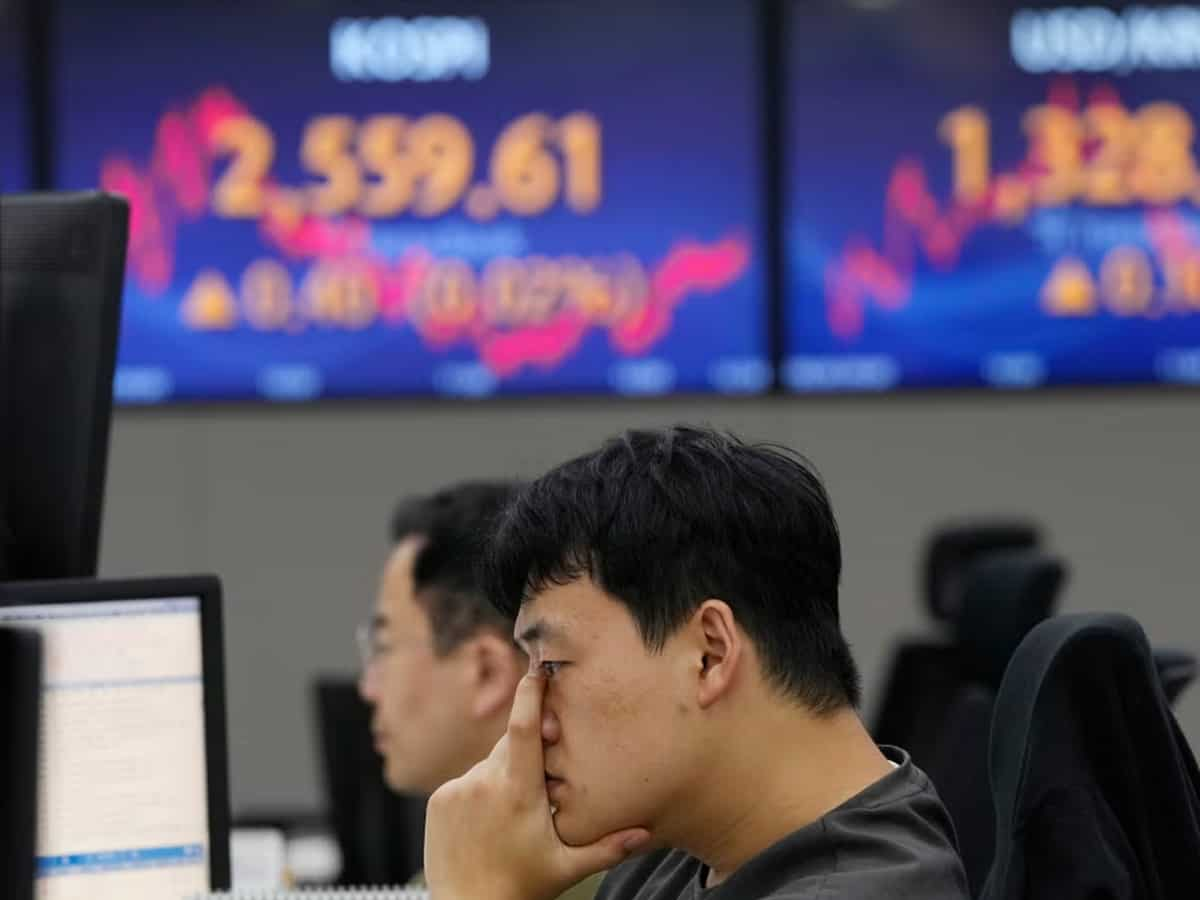 Asia stocks skid on weak China data, yen dives as BOJ tweaks yield control