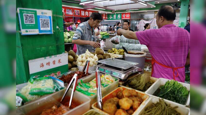China's consumer prices dip back into decline amid limp demand