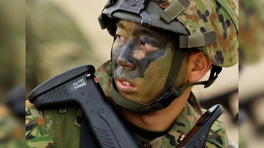 Japanese troops drill on island seen as vulnerable to China