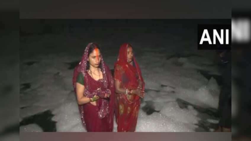 Delhi: Devotees stand in knee-deep toxic foam in Yamuna for Chhath Puja