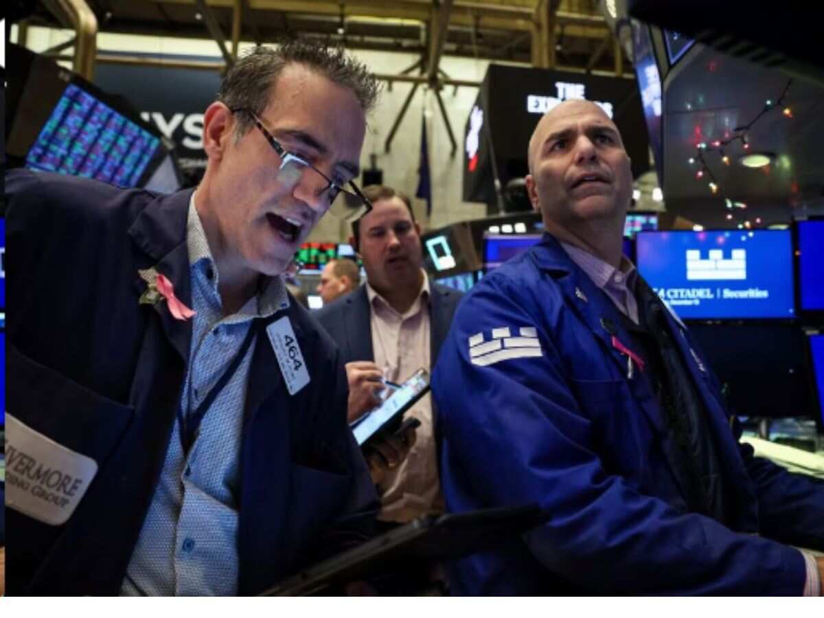 Dow ends at record high as Fed signals lower borrowing costs in 2024