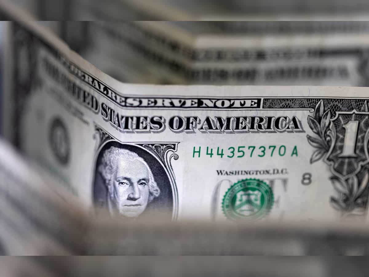 Dollar edges lower but poised for weekly gain as early rate cut hopes dim