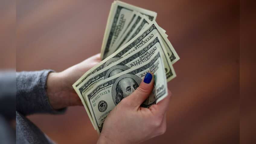 Dollar steady as traders weigh economic data, yen fragile