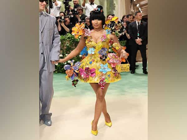 Nicki Minaj walks in a 3D floral minidress