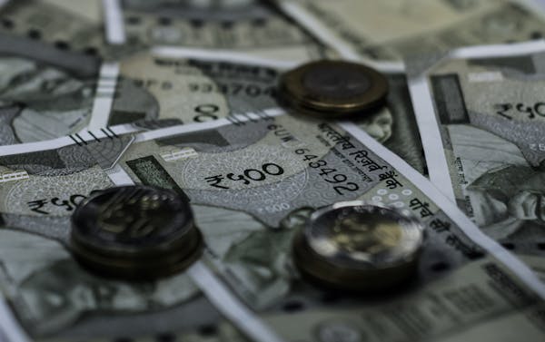 Rupee falls 4 paise to close at 83.52 against US dollar