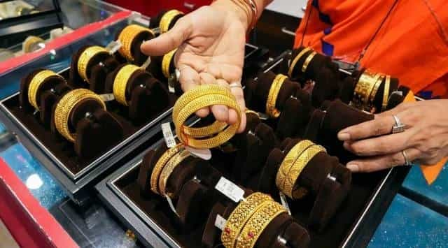 Gold price gains capped on hawkish Fed comments 