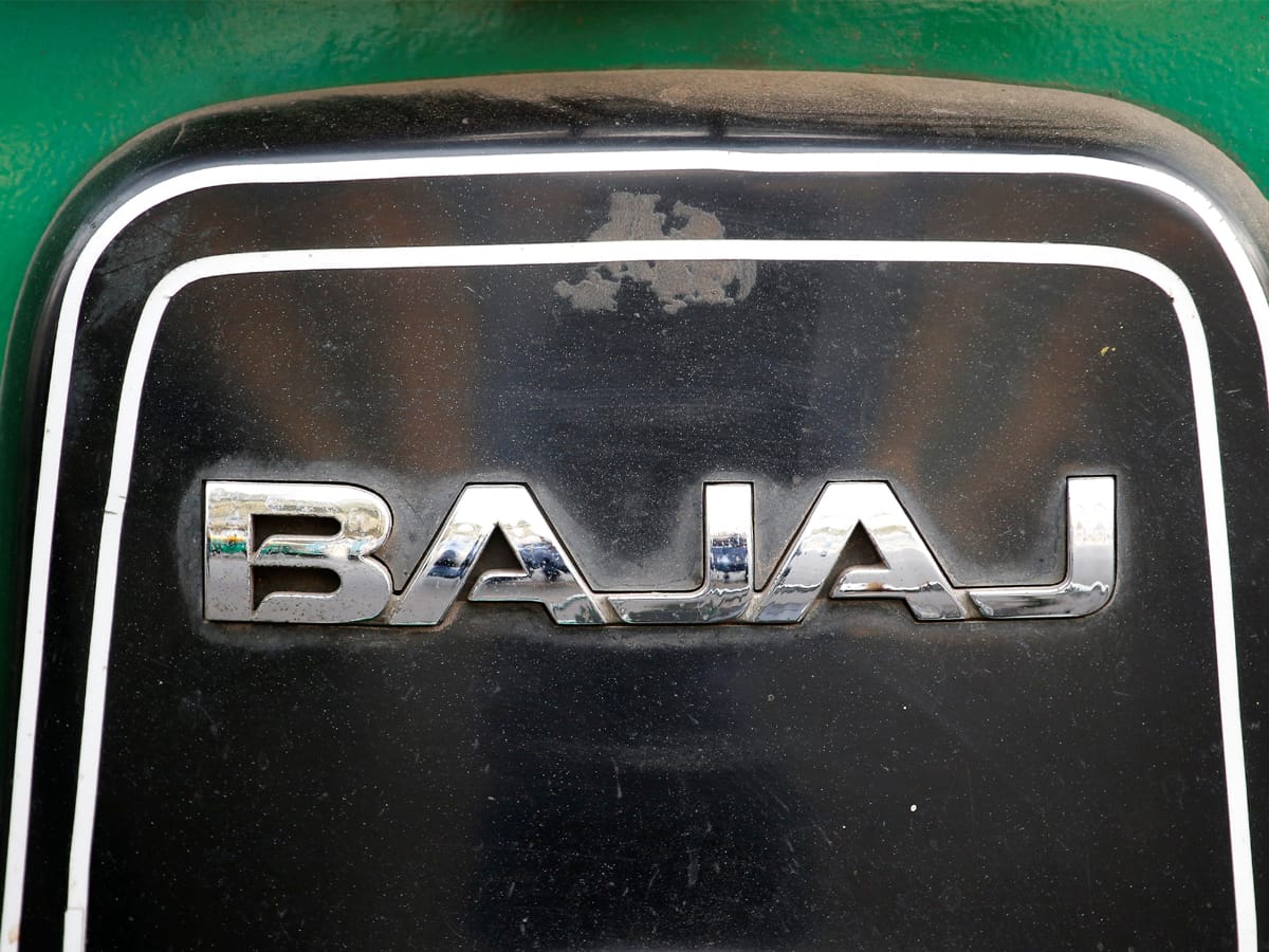 Bajaj Auto slumps to 52-week low as February sales dip; Bajaj Finserv also takes a hit
