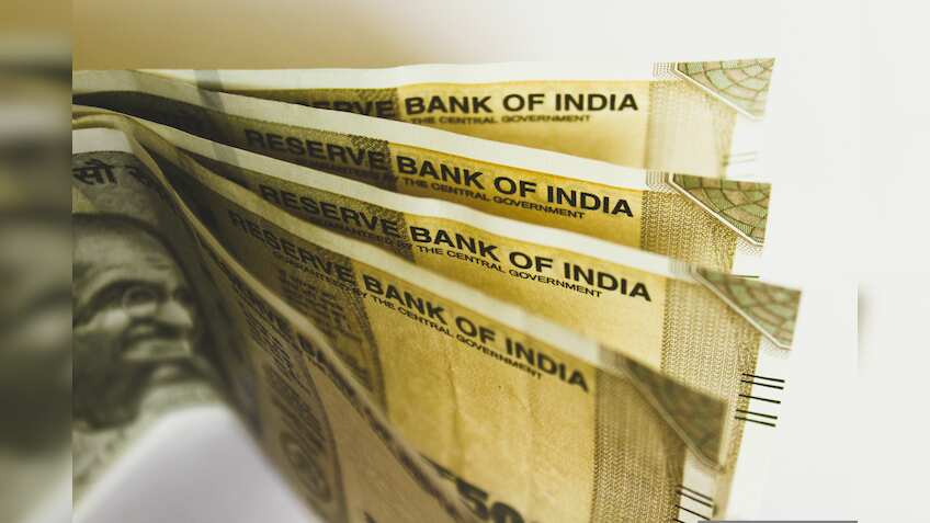 Rupee inches lower to 87.28 vs US dollar
