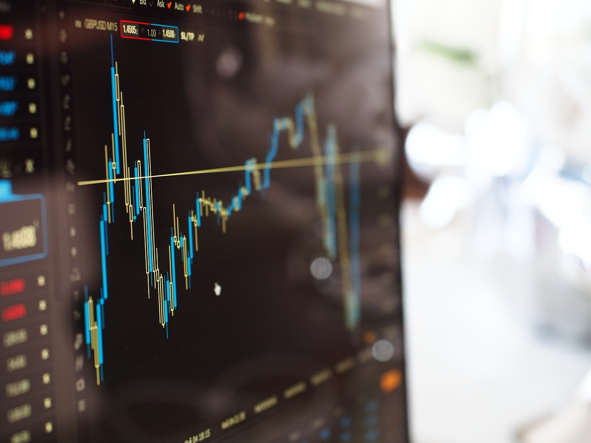 Sensex, Nifty flat in afternoon trade as FMCG stocks rise; Indian Rupee slips on US tariff threat against BRICS